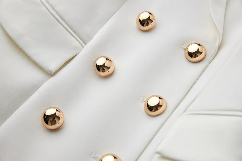 Gold buttons on white dress